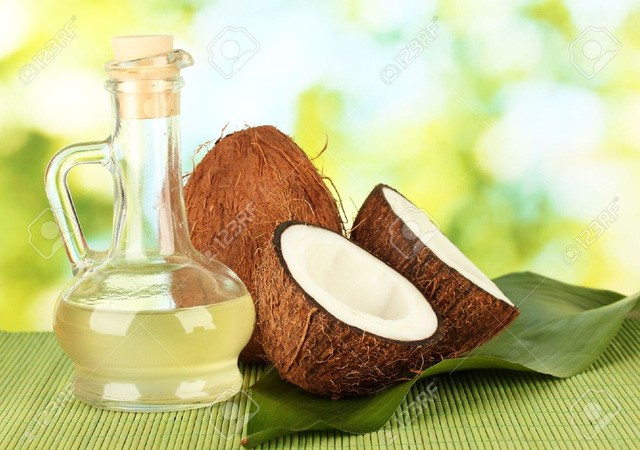 15283076-decanter-with-coconut-oil-and-coconuts-on-green-background-16303189508741589793551-1630384754.jpg